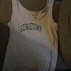 This tank top is a brandy Melville and is size small it is also the color grey